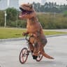 dinosaur riding a bike
